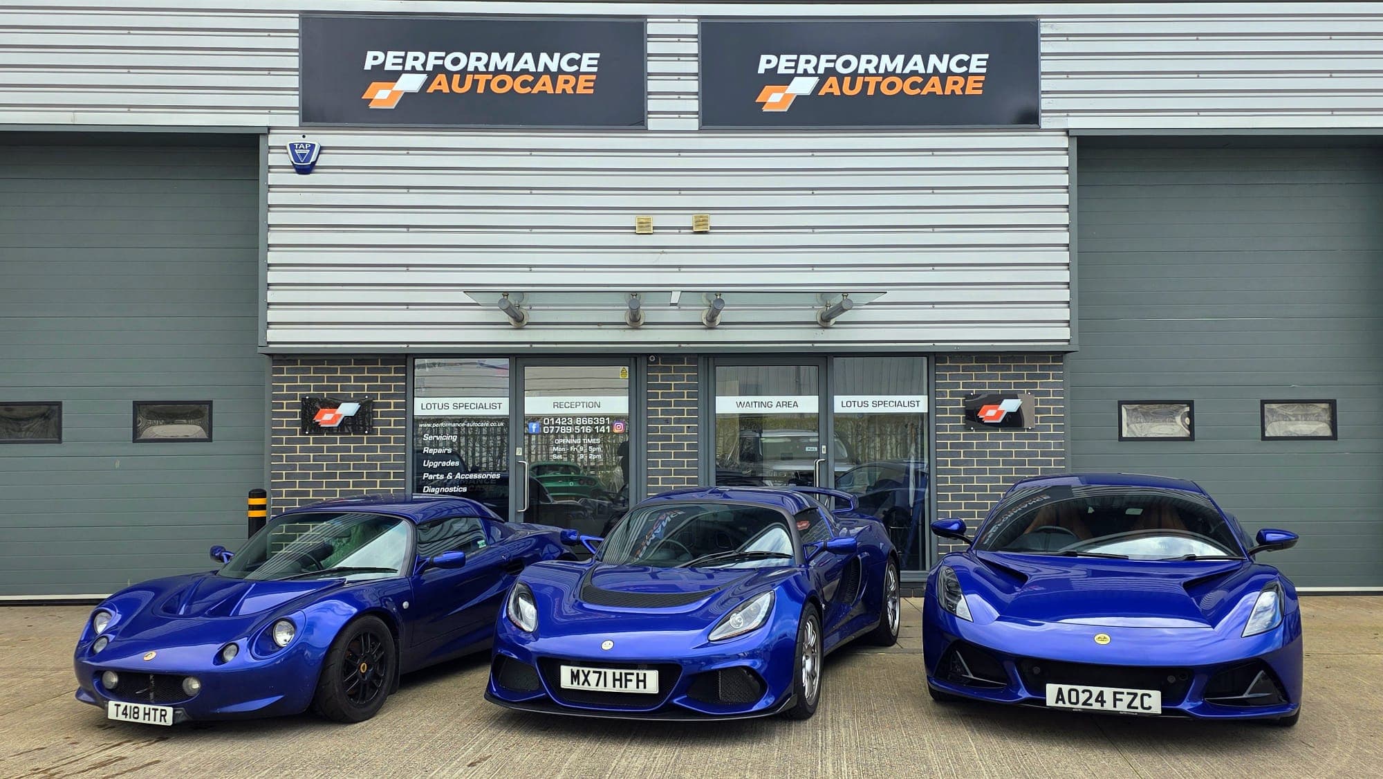 Three blue Lotus outside the Performance Autocare workshop